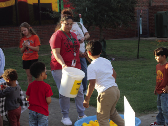 BOTTOM RIGHT: Teacher Magali Medrano runs a game for some of the students at Columbus Elementary. Photos attributable to Citizen | Evan Hale