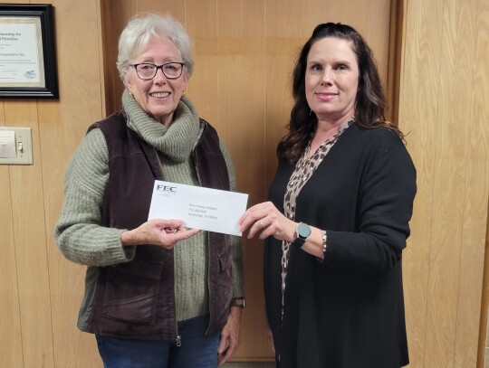 Funds donated by members of Fayette Electric Cooperative were donated to the Mini Horse Helpers. Pictured from left are Mini Horse Helpers Vice President/Executive Director Sally Van Duyn and Fayette Electric Cooperative Marketing and Training Coordinator