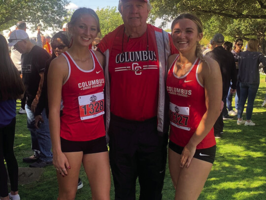 Chloe Ross (left) along with head coach Mike Albers and Kaylea Foster taking a picture together after the State Championship Courtesy Photo race.