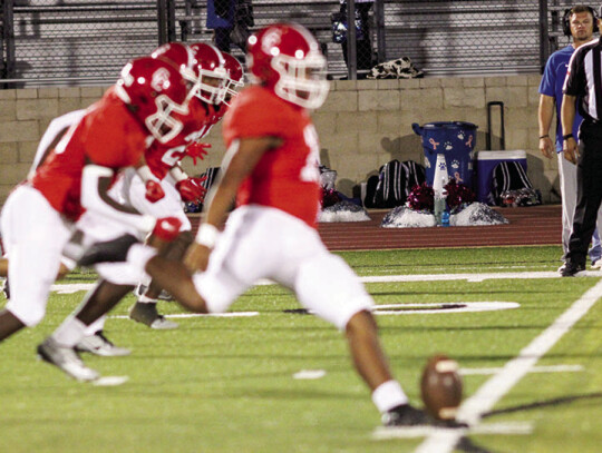 Javier Mendoza boots away the opening kickoff.