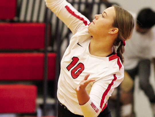 Sydnie Shepard serving the ball to start the point.