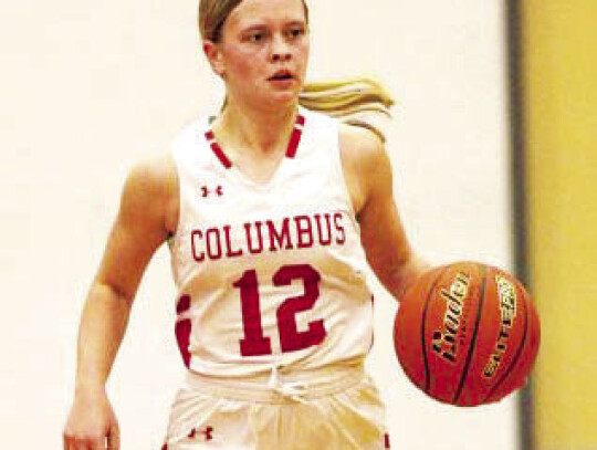 Karlee Mathis carrying the ball up the court before getting set up on offense.