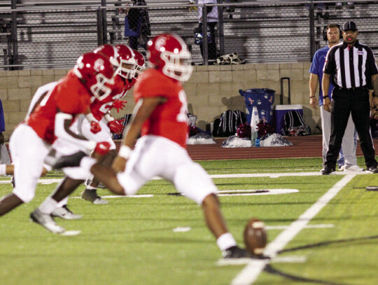 Cardinals’ kicker Javier Mendoza kicking the ball off to start the game.