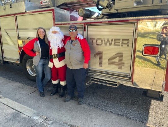 Santa got some help from firefighters Tony and Anna to tour around Columbus. Courtesy photos