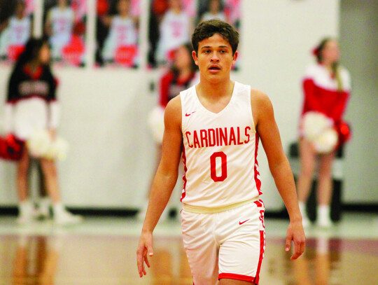 Camdon Pitchford running to his spot to be an option to pass to for a three-point shot.