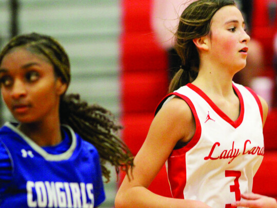 Thea Schobel getting back on defense after the Lady Cards scored on a layup.