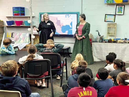 Kathleen Townzen and Donna Pustejovsky present the Pioneer Life Trunk to CES fourth-graders.