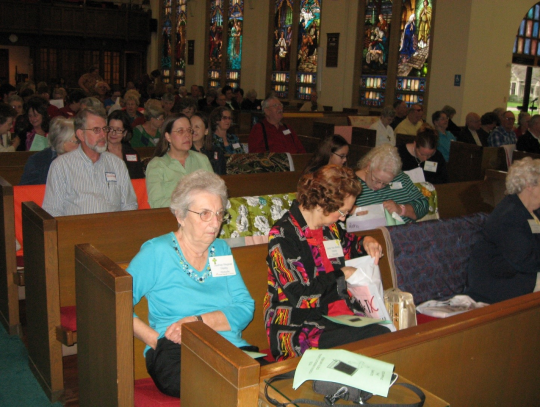 Attendees at ETS event gathering for worship and celebration of the Sacrament. Courtesy photos