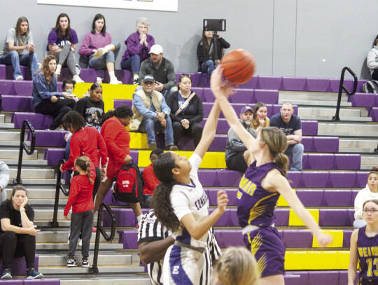 Chandley Tolbert reaching up for the opening tip-off to start the game against Edna.