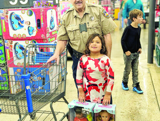 Donnie Templeton participating in the Shop with a Cop event. Citizen | Trenton Whiting