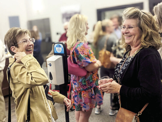  Pictured at the mixer are Chamber executives Janet Hollman and Director Becky Nutt.