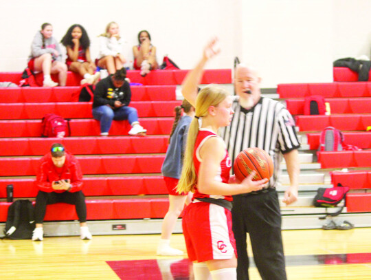 Lady Cards senior guard Karlee Mathis checking the ball in after forcing a turnover.