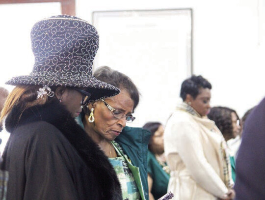 Churchgoers read a Bible passage during New Greater Smith Chapel Baptist Church’s 125th Church Anniversary Sunday, Jan. 14 in Columbus. Special to the Citizen | Alesia Woolridge