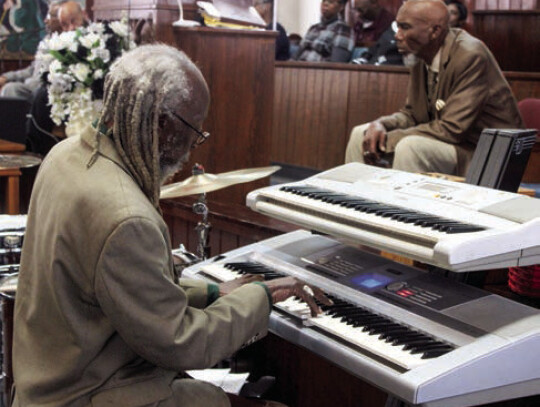 Dr. Robert Sanders renders a musical tribute during the 125th Church Anniversary at New Greater Smith Chapel Baptist Church Sunday, Jan. 14. His father served as one of the church’s pastors and his mother was the church pianist.