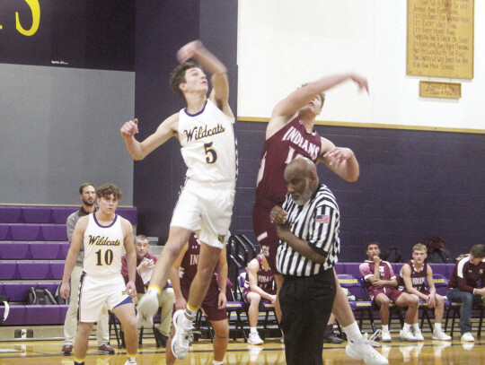 Huxton Kloesel with the tip off to start the district game against Flatonia.