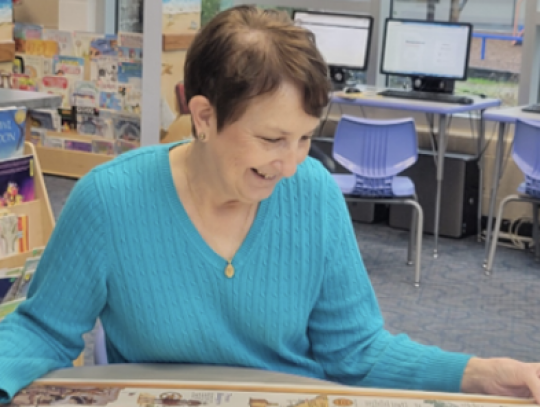 Joan Hill, St. Anthony librarian, studies the new map.