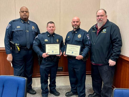 Sergeants Dustin Blackburn and Patrick Gonzales received certificates for their completion of a two-week training program. Pictured from left are Chief Donald Chaney, Sergeant Dustin Blackburn, Sergeant Patrick Gonzales and City Manager Charles Jackson.