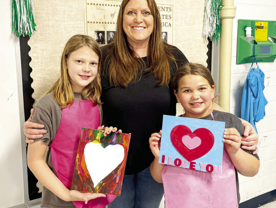 St. Michael students pictured at the Thursday After School Art program are Kelsey Weid, Instructor Angela Heger and Kassie Moeller. Not pictured is Kyle Barrow.