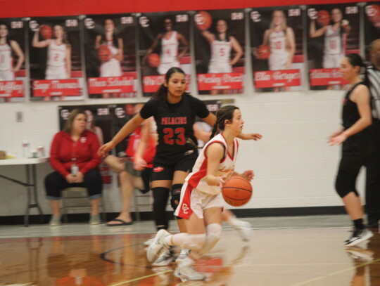 Candee Pitchford running past a defender before drawing a foul. Citizen | Evan Hale