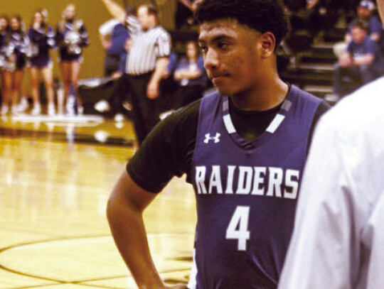 Jalen Porch getting some last second strategy during a timeout.