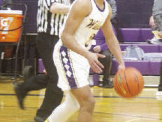 Jerron Fisher brings the ball down court. While he is focusing on his next play.