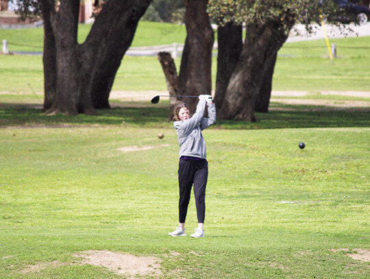 Hannah Hillje teeing off on hole three where she was able to clear the water. Citizen | Evan Hale