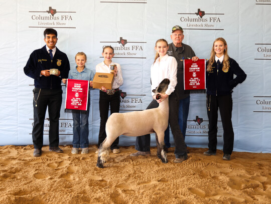 Mackenzie Daniel; Bought by Tonkawa Farms/ Hildebrand Family for $3,300. Pictured with Javier Mendoza, Alley Fitzgerald and the Hildebrand Family.