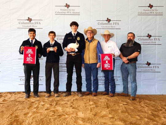 Cade Neumann; Bought by Cavender Auto Country $5,500. Pictured with Javier Mendoza, Shane Kulhanek, Jim Sanders, Phil Garza and Ben Lederman.