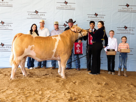 Brooke Wanjura; Bought by Champion Buyer’s Group for $ 10,750. Pictured with Javier Mendoza and members of the Champion Buyer’s Group.