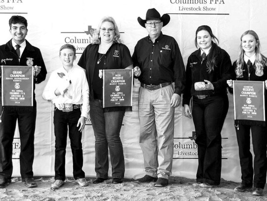 FRYER RABBITS Miles Fuchs; Bought by Industry State Bank for $2,300. Pictured with Javier Mendoza, Lisa Moeller, Dwight Mazak, Brooke Wanjura and Alley Fitzgerald.