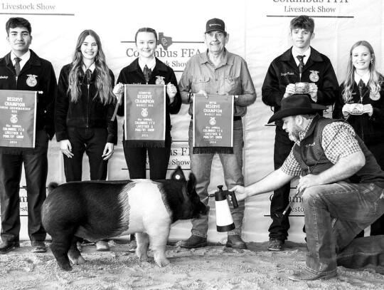 MARKET HOG Abigail Fisher; Bought by Mikeska BBQ for $2,500. Picture with Javier Mendoza, Hannah Kunschick, Brayden Fisher, Alley Fitzgerald and representatives from Mikeska’s BBQ.