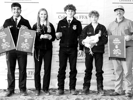 BROILERS Ryan Heffley; Bought by Harrell Dentistry for $3,300. Pictured with Javier Mendoza, Ally Fitzgerald, Ross Heffley and Tyson Harrell.