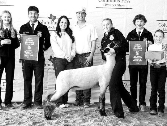 MARKET SHEEP Savannah Daniel; Bought by American Ag LLC for $3,299. Pictured with Alley Fitzgerald, Javier Mendoza, Hannah Pilat, Brentyn Pilat, Kaden Pilat and Parker Pilat.