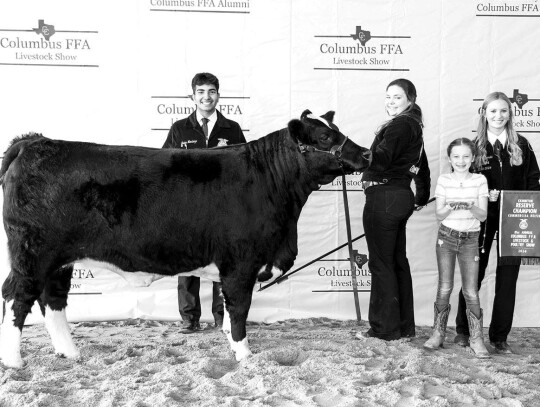 COMMERCIAL HEIFER Brooke Wanjura; Pictured with Javier Mendoza, Alley Fitzgerald and a family member.