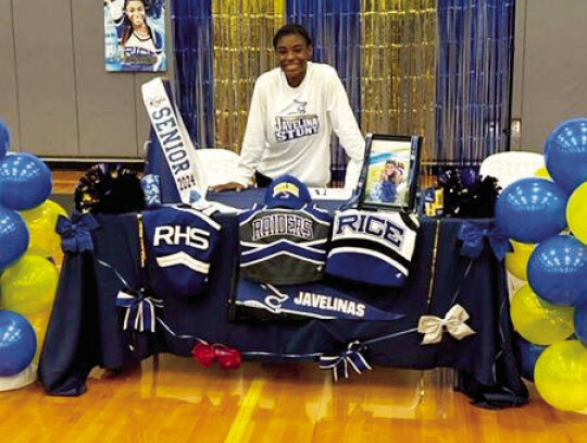 Kayla James put pen to paper in the Rice Consolidated ISD gymnasium on Thursday, March 8, signing her letter of intent to join the Texas A&amp;M University Kingsville stunt team.