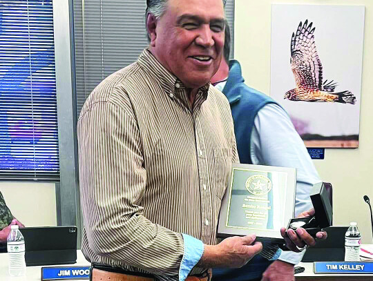 Benito Rangel receives a plaque for his dedication throughout his tenure.