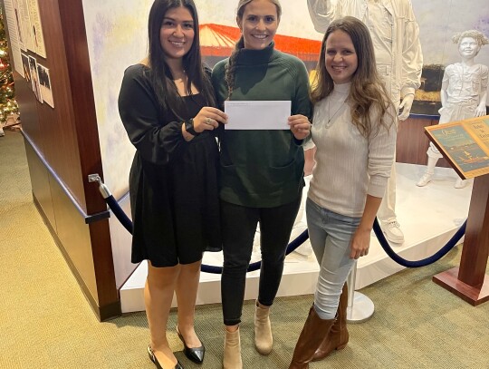 Pictured from left are Melanie Ramirez, Destiny Siptak and Cheryl Pekar as the Stanzel Family granted money to the Turtle Wing Foundation.