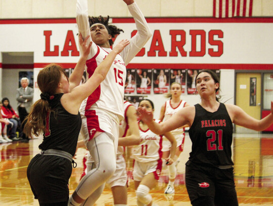 Anaya Gardner fights through contact to score a layup and draw a foul.