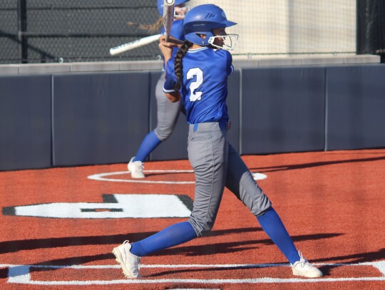 Lexia Rangel swinging and fouling a ball off.