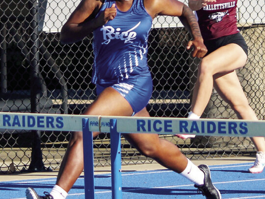 Tatiana Mills competing in 110m hurdles where she won the District Championship.